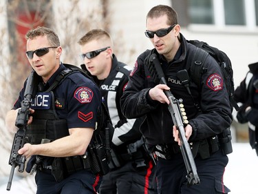 Calgary police at the scene in Abbeydale on Tuesday March 27, 2018 where a police officer was shot. The officer is reportedly in stable condition.