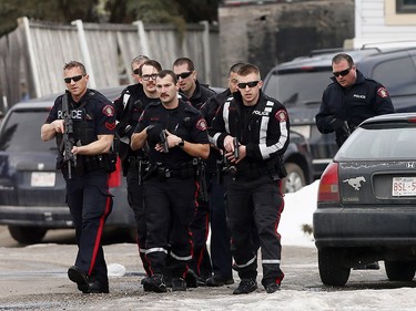 Calgary police at the scene in Abbeydale on Tuesday March 27, 2018 where a police officer was shot. The officer is reportedly in stable condition.