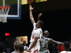 SAIT's Julian Apakoh flies to the rim Thursday night at the CCAA nationals in Quebec City.
