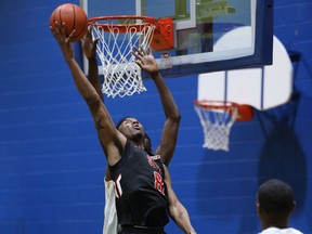 SAIT's Gemie Muya scores two of his 18 points on Friday, March 16, 2018, against Humber College at the CCAA nationals.