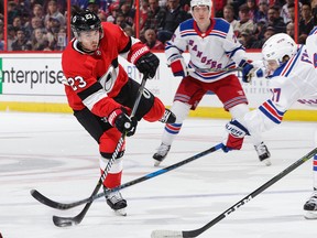 Nick Shore of the Ottawa Senators shoots the puck as Jesper Fast #17 of the New York Rangers makes a stick check in the second period at Canadian Tire Centre on Feb. 17, 2018.