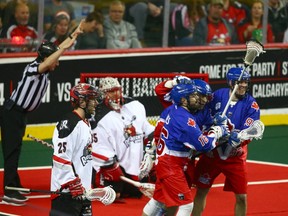 Toronto Rock players celebrate an early goal during National Lacrosse League action between the Toronto Rock and the Calgary Roughnecks in Calgary on Saturday.