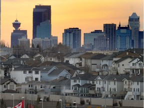 The city of Calgary skyline peeks up behind the neighbourhood of Panorama Hills in northwest Calgary.