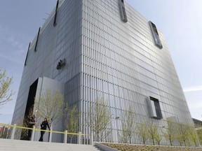 In this April 21, 2014 file photo, authorities secure the plaza as police investigate a shooting inside the Federal Courthouse in Salt Lake City. Dramatic video released Monday, March 12, 2018, shows a U.S. marshal firing four times at close range at a defendant inside the Utah federal courthouse after he rushed the witness stand, jumped and swung with a pen at a shackled witness who barely backed out of the way.