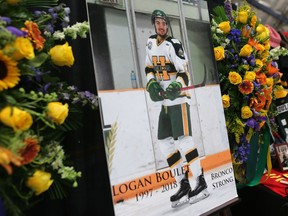 Displays set up at Logan Boulet's funeral at Nicholas Sheran Ice centre in Lethbridge on Saturday.