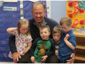 Rod Spittle, Canadian PGA TOUR Champions player, poses with Avery Leslie, left, Sebastian Badelita, Jacob O'Connell and Carter Murray at Calgary's PREP program in Calgary, on Thursday April 26, 2018, after reading to them. Leah Hennel/Postmedia
