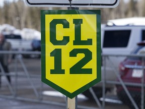 CL12 signs have been set up around Slave Alberta, Wednesday April 18, 2018. A funeral service for Humboldt Broncos' player Conner Jamie Lukan was held in Slave Lake Wednesday.