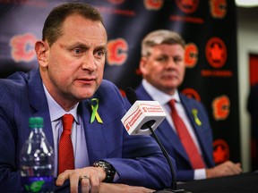 Calgary Flames GM Brad Treliving and the teams new head coach Bill Peters during a press conference in the Ed Whalen Media Lounge at the Scotiabank Saddledome in Calgary.  Al Charest/Postmedia
