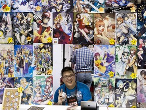 Andrew Jong mans a booth for artist Gigi Lau during a past Calgary Comic and Entertainment Expo.