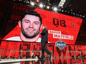 NFL Commissioner Roger Goodell walks past a video board displaying an image of Baker Mayfield after he was picked first overall by the Cleveland Browns during the 2018 NFL draft at AT&T Stadium on April 26, 2018 in Arlington, Texas. (Ronald Martinez/Getty Images)