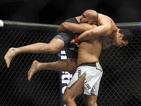 Luis Henrique of Brazil is lifted by Arjan Singh Bhullar of Canada during their mixed martial arts bout at UFC 215 in Edmonton, Alta., on Saturday September 9, 2017. THE CANADIAN PRESS/Jason Franson