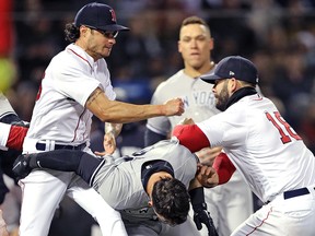 Mitch Moreland of the Boston Red Sox, right, works to separate teammate Joe Kelly and Tyler Austin of the New York Yankees during a brawl at Fenway Park on April 11, 2018 in Boston. (Maddie Meyer/Getty Images)