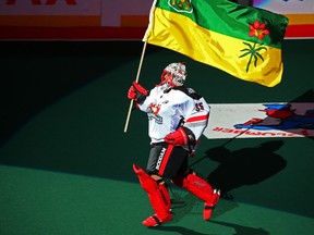 Calgary Roughnecks goaltender Christian Del Bianco carries the Saskatchewan provincial flag as part of  honouring the Humboldt Broncos before their National Lacrosse League game in Calgary on Saturday April 14, 2018.