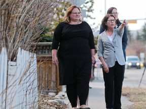 Celia Posyniak, Executive Director at Kensington Clinic, centre, tours Minister of Health Sarah Hoffman, left and Minister of Justice and Attorney General Kathleen Ganley around the bubble zone at the women's health clinic in Calgary on Wednesday April 25, 2018.  Bill 9, the Protecting Choice for Women Accessing Health Care Act, would create a 50 metre zone around women's health clinics to prevent harassment and fine repeat offenders. Gavin Young/Postmedia