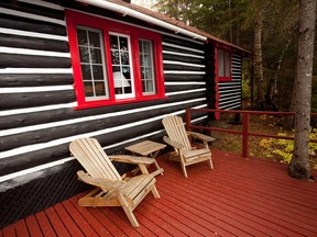 Adirondack Chairs and Rustic Cabin in the Woods