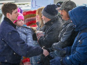 Edouard Maurice makes his way into the Okotoks Provincial Court Building, the local landowner faces criminal charges after trying to protecting his property from intruders.