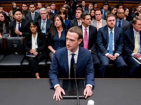 In this Aprill 11, 2018, photo, Facebook CEO Mark Zuckerberg arrives to testify before a House Energy and Commerce hearing on Capitol Hill in Washington, about the use of Facebook data to target American voters in the 2016 election and data privacy.