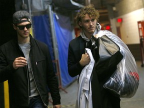 Calgary Flames Matthew Tkachuk and Mark Jankowski during green garbage bag day at the Scotiabank Saddledome in Calgary, Alta., on Monday, April 9, 2018. Darren Makowichuk/Postmedia