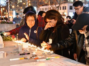 People attend a makeshift memorial near Yonge and Finch on April 23, 2018 after the van attack. (EXimages/WENN.com)
