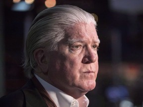 Calgary Flames president of hockey operations Brian Burke talks to media following a news conference in Toronton on June 27, 2017.