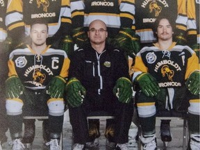 Head coach and general manager Darcy Haugan, centre, is shown in team photo of the 2016/2017 Humboldt Broncos hockey team as it hangs in Elgar Petersen Arena in Humboldt, Sask., on Saturday, April 7, 2018. The head coach of the Humboldt Broncos hockey team is among 16 dead following a horrific bus crash in Saskatchewan. Darcy Haugan was on the junior hockey team's bus Friday, April 6, 2018, on the way to a playoff game in northeastern Saskatchewan when it collided with a truck.