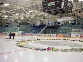 Flowers and other items continue to be added to a memorial on centre ice at Elgar Petersen Arena in Humboldt, Sask., on Monday, April 9, 2018.