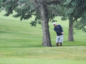Hogan-WinningShot: Thanks to this punch-shot from between two trees, Brett Hogan won the 2017 Sun Life Alberta Men's Amateur Championship with a birdie on the second playoff hole at Ponoka Community Golf Club. The Calgarian has claimed the title twice in a three-year span. (Wendy Davies/Alberta Golf)