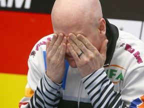 Kevin Koe gestures as he warms up before the first game at the Pinty's Grand Slam of Curling Humpty's Champions Cup event at WInSport in Calgary on Tuesday, April 24, 2018. Jim Wells/Postmedia