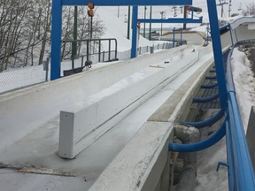 Shot of swinging barricade that was locked to the left when Evan and Jordan Caldwell came down the bobsled run. Kevin Martin