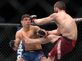 Khabib Nurmagomedov (R) lands a kick on Al Iaquinta (L) during their UFC lightweight championship bout at UFC 223 at Barclays Center on April 7, 2018 in New York City. (Ed Mulholland/Getty Images)