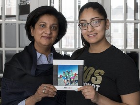 Bhavini Ruparell (left) and her daughter, Jyoti, hold a picture that was taken of their family after the 2016 Kidney March. Ruparell was the recipient of the kidney that she has now had for 26 years. She’s reminding those signing up to be organ donors to talk to their families and make their wishes known. KERIANNE SPROULE/POSTMEDIA