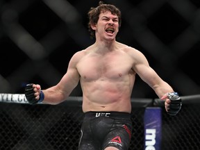 Olivier Aubin-Mercier celebrates his first round win over Evan Dunham during their lightweight bout at UFC 223 at Barclays Center on April 7, 2018 in New York City. (Ed Mulholland/Getty Images)
