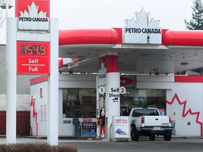 In this file photo, a near-record price of 154.9 c/litre is displayed at a Petro-Canada gas station in Vancouver, BC., on March 18, 2018.