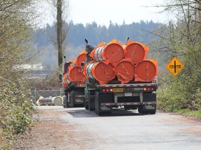 NEW WESTMINSTER, B.C.: April 16, 2018 -- Handout photo of a pipe delivery. On Thursday, April 12, pipe was delivered to a staging area in New Westminster for Kinder Morgans $7.4-billion Trans Mountain oil pipeline expansion. The delivery happened four days after Kinder Morgan said it was suspending all non-essential spending on the project and delivered  an ultimatum it needs certainty by May 31 it can build the project or it will walk away.Photo credit:  Wilderness Committee. [PNG Merlin Archive]