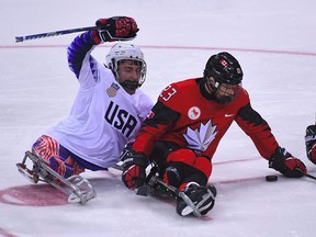 Canada's Liam Hickey and USA's Brody Roybal compete in the  gold medal game in Pyeongchang on March 18, 2018. Former national sledge hockey player Chris Cederstrand hopes he can be a mentor to Ryan Straschnitzki, who was injured in the Humboldt Broncos bus crash.