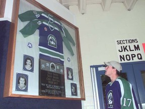 Swift Current Broncos right winger Chris Szysky looks at the memorial to four players killed in a tragic bus accident in 1986.