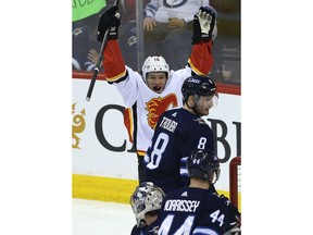 Calgary Flames forward Spencer Foo celebrates his first NHL goal, against the Winnipeg Jets in Winnipeg on Thurs., April 5, 2018. Kevin King/Winnipeg Sun/Postmedia Network