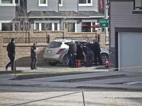 Calgary police investigate a shooting in Evanston that left two men dead on April 20, 2018.