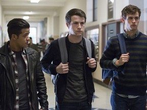 This image released by Netflix shows, from left, Christian Navarro, Dylan Minnette and Brandon Flynn in "13 Reasons Why." (Beth Dubber/Netflix via AP)