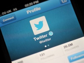 In this photo illustration, The Twitter logo is displayed on a mobile device as the company announced it's initial public offering and debut on the New York Stock Exchange on November 7, 2013 in London, England.