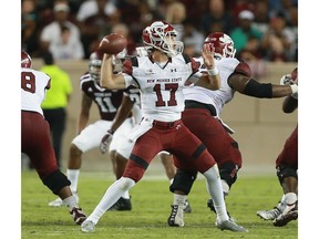 COLLEGE STATION, TX - OCTOBER 29:  Tyler Rogers #17 of the New Mexico State Aggies looks for a receiver against the Texas A&M Aggies in the second quarter at Kyle Field on October 29, 2016 in College Station, Texas.