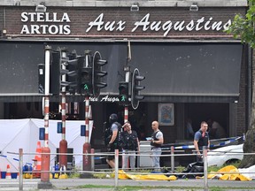 Police investigate at the scene of a shooting in Liege, Belgium, Tuesday, May 29, 2018.