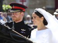 Meghan Markle and Prince Harry leave after their wedding ceremony, at St. George's Chapel in Windsor Castle in Windsor, near London, England, Saturday, May 19, 2018. (Gareth Fuller/pool photo via AP)