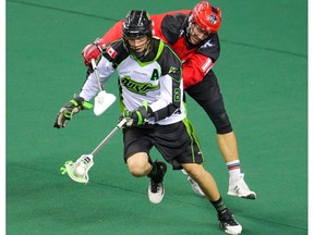 The Calgary Roughnecks' Wesley Berg chases down the Saskatchewan Rush's Brett Mydske during National Lacrosse League action in Calgary on Saturday April 29, 2017. Gavin Young/Postmedia Network