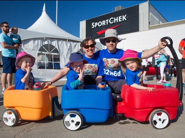 Kendra and Mark Coates get ready to head out with their three and half year-old triplets Clara, left Jack and Amelia at the annual Sport Chek Mother's Day Run Walk and Ride at Chinook Centre on Sunday May 13, 2018. The siblings were all born early at just over 32 weeks and spent time in the NICU. The Mother's Day Run is a fundraiser for the neonatal intensive care units in Calgary.