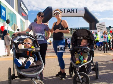 Moms Rachelle Thompson with son Jayson and Jaclyn Ruddy with son Samson get ready to run with about 6000 other runners, walkers and riders in the annual Sport Chek Mother's Day run at Chinook Centre on Sunday May 13, 2018. The event is a fundraiser for the neonatal intensive care units in Calgary.