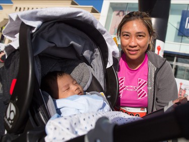 Mom Maricel Tarroja gets ready to run with son John in the annual Sport Chek Mother's Day Run and Walk at Chinook Centre on Sunday May 13, 2018. The event is a fundraiser for the neonatal intensive care units in Calgary.