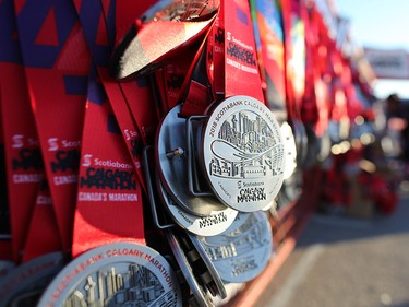 Finisher medals await runners at the finish line of the Scotiabank Calgary Marathon at Stampede Park on Sunday May 27, 2018.