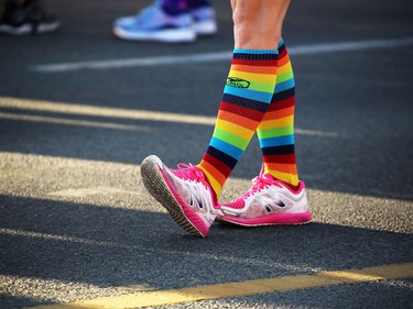 Rainbow power as runners stretch before the start of the Scotiabank Calgary Marathon and Half Marathon at Stampede Park on Sunday May 27, 2018.