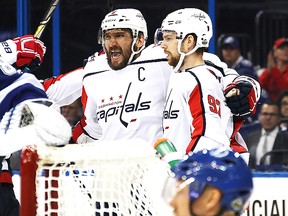 Alex Ovechkin #8 of the Washington Capitals celebrates with teammate Evgeny Kuznetsov #92 after scoring a goal against Andrei Vasilevskiy #88 of the Tampa Bay Lightning. (Photo by Bruce Bennett/Getty Images)